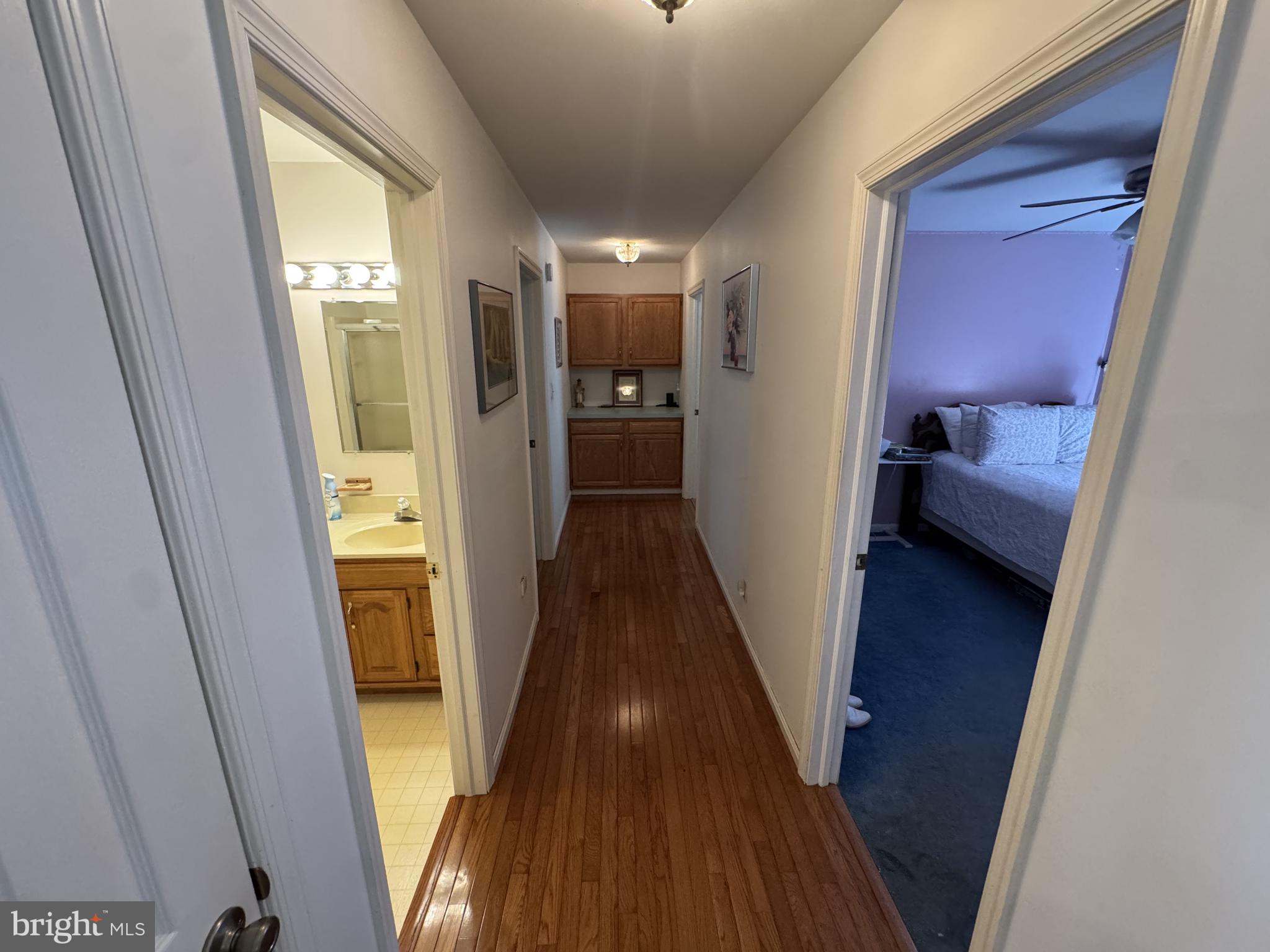 174 Pine Tree Road Townsend, DE 19734 - Photo 21 of 79 Hallway hardwood leading to the 3 bedrooms
