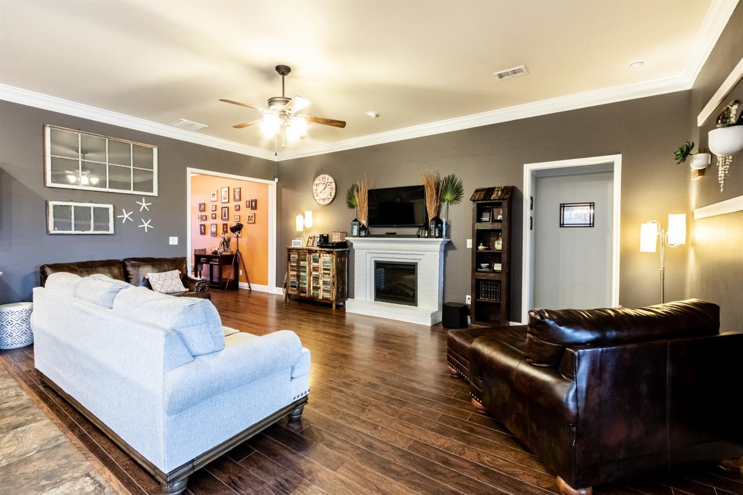 9301 Rochester Avenue Lubbock, TX 79424 - Photo 12 of 49 a living room with furniture fireplace and flat screen tv