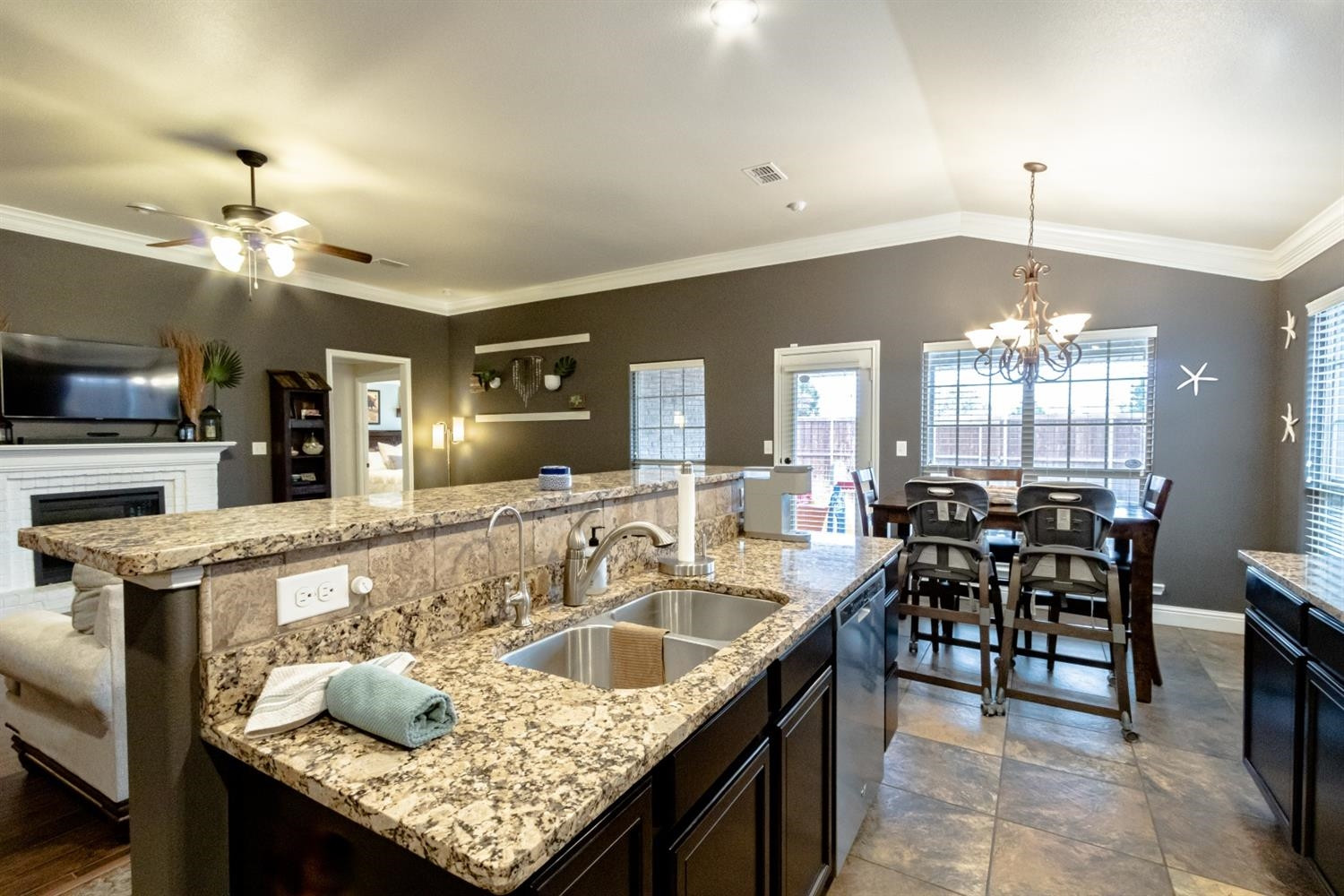 9301 Rochester Avenue Lubbock, TX 79424 - Photo 20 of 49 a kitchen island with granite countertop dining room