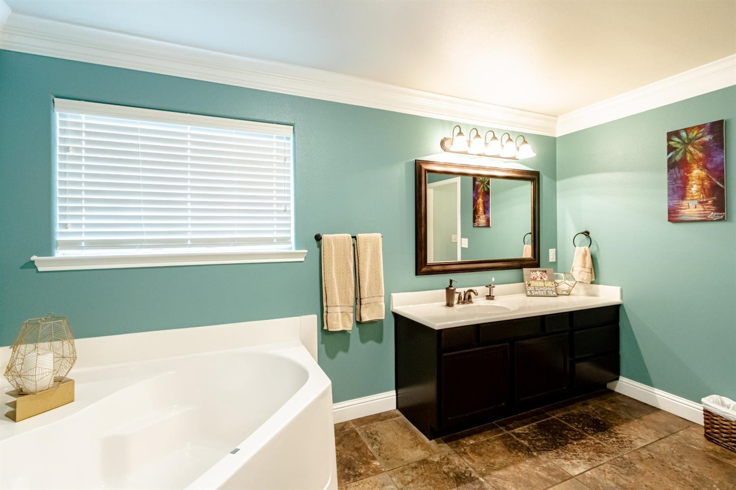 9301 Rochester Avenue Lubbock, TX 79424 - Photo 27 of 49 a bathroom with a sink and a mirror