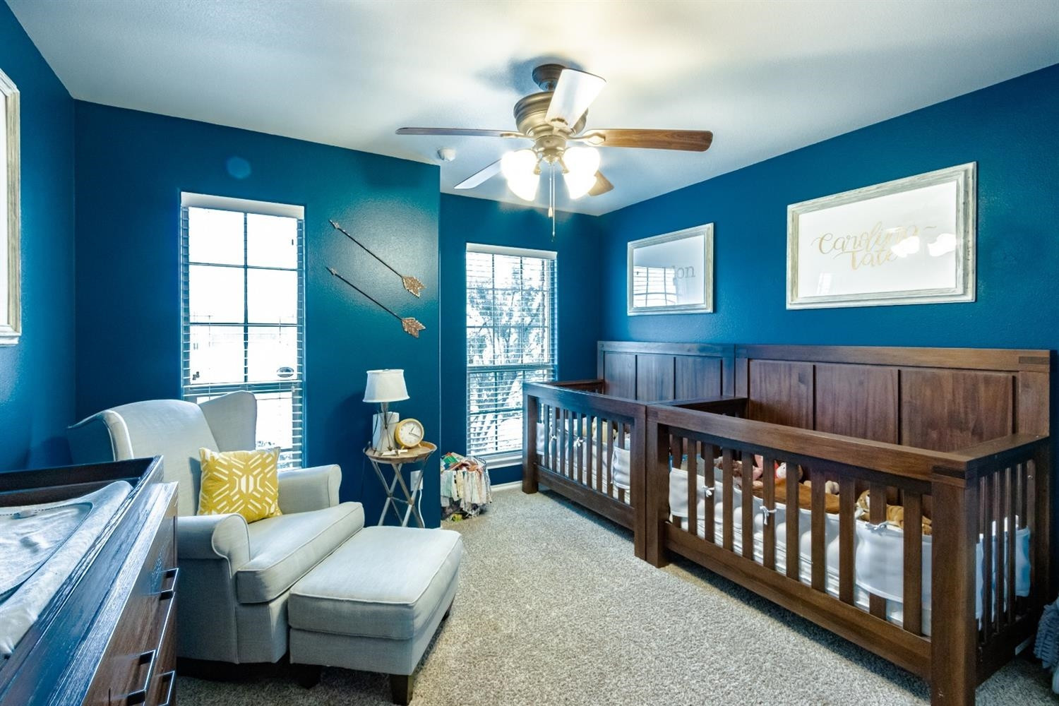 9301 Rochester Avenue Lubbock, TX 79424 - Photo 29 of 49 a bedroom with furniture and a chandelier