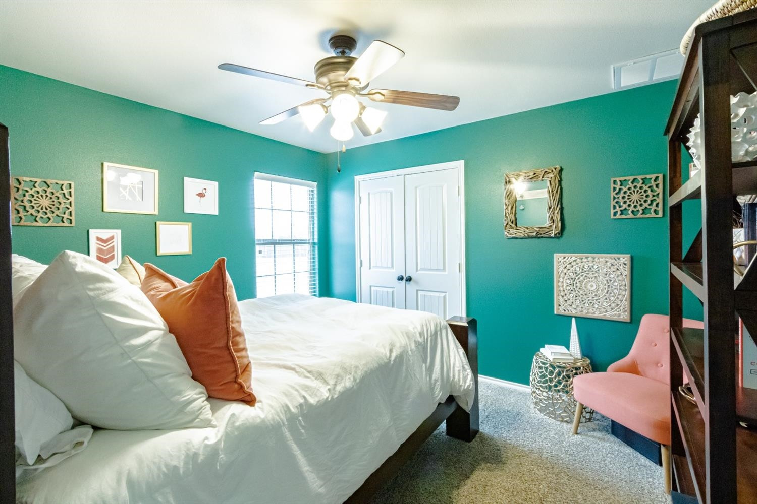 9301 Rochester Avenue Lubbock, TX 79424 - Photo 33 of 49 a bedroom with a bed and ceiling fan
