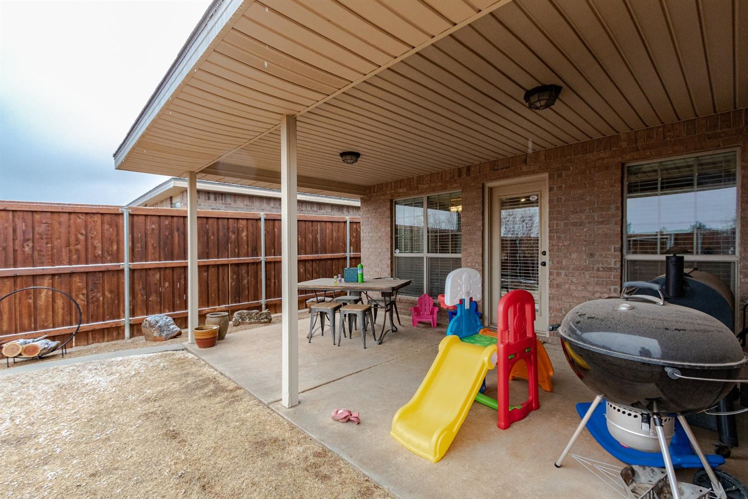 9301 Rochester Avenue Lubbock, TX 79424 - Photo 37 of 49 a view of a swimming pool with a table and chairs