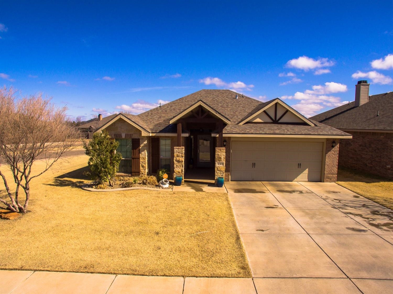9301 Rochester Avenue Lubbock, TX 79424 - Photo 45 of 49 a front view of a house with a yard