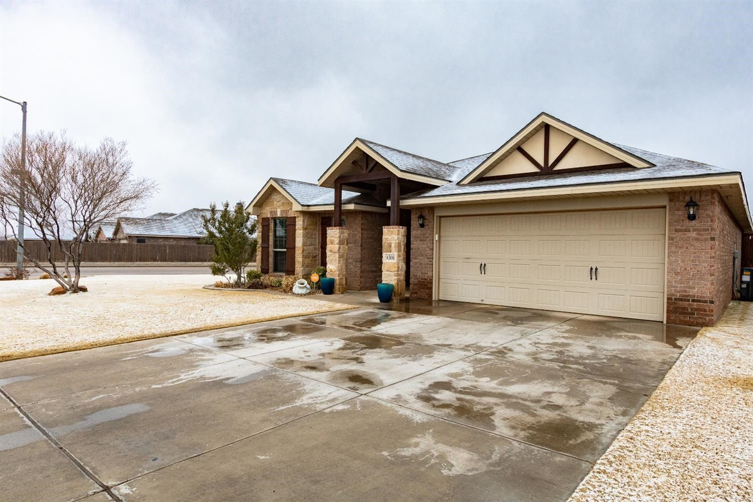 9301 Rochester Avenue Lubbock, TX 79424 - Photo 7 of 49 a front view of a house with a yard