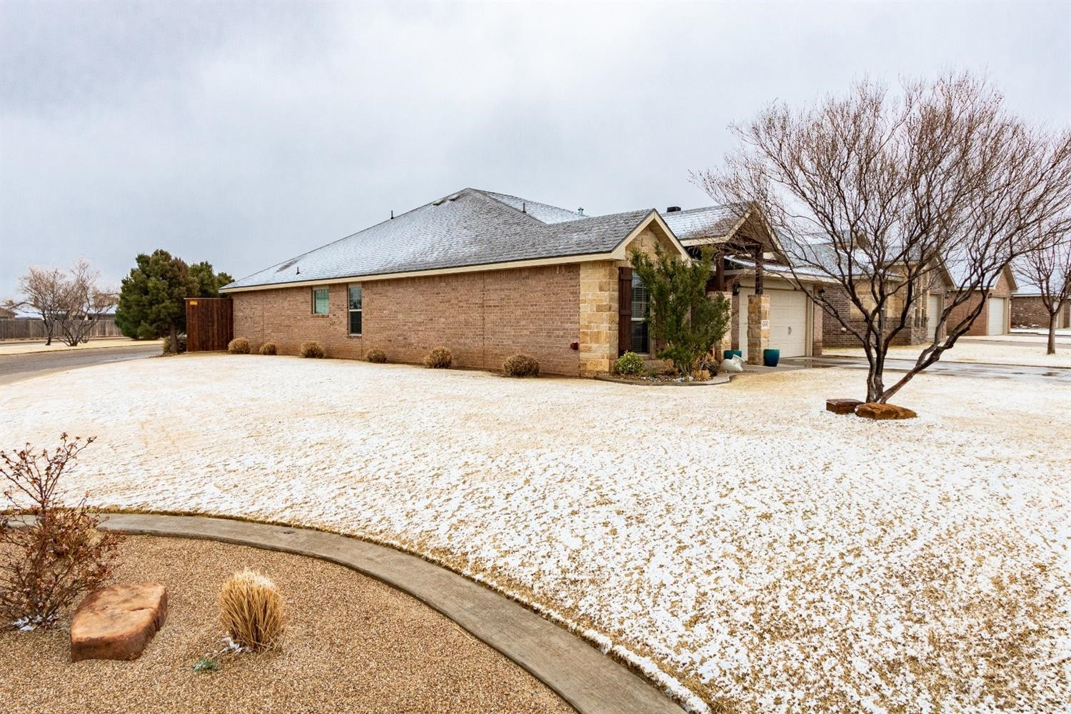 9301 Rochester Avenue Lubbock, TX 79424 - Photo 8 of 49 a view of a house with snow on the road