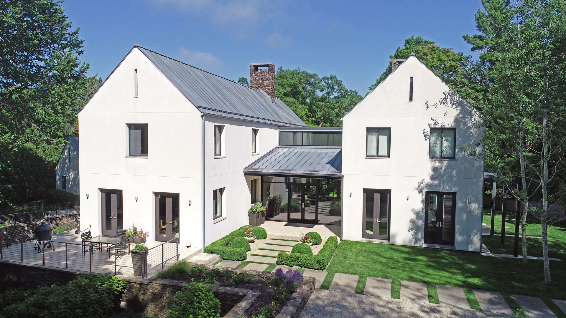 435 Thorne Lane Lake Forest, IL 60045 - Photo 2 of 42 a front view of a house with a yard and potted plants