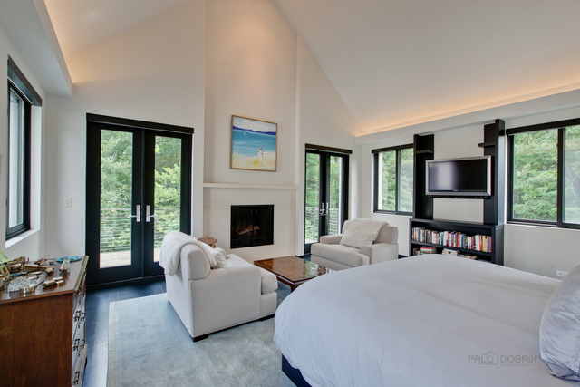 435 Thorne Lane Lake Forest, IL 60045 - Photo 19 of 42 a living room with furniture large window and a fireplace