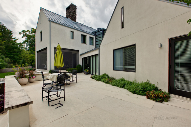 435 Thorne Lane Lake Forest, IL 60045 - Photo 42 of 42 a view of a patio with couches table and chairs and potted plants