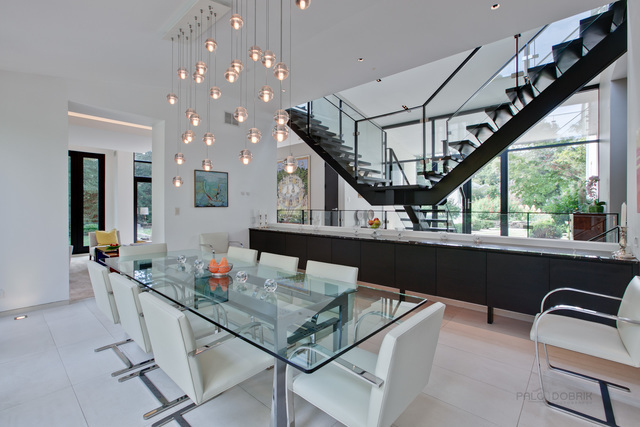 435 Thorne Lane Lake Forest, IL 60045 - Photo 8 of 42 a view of a dining room with furniture a chandelier and wooden floor