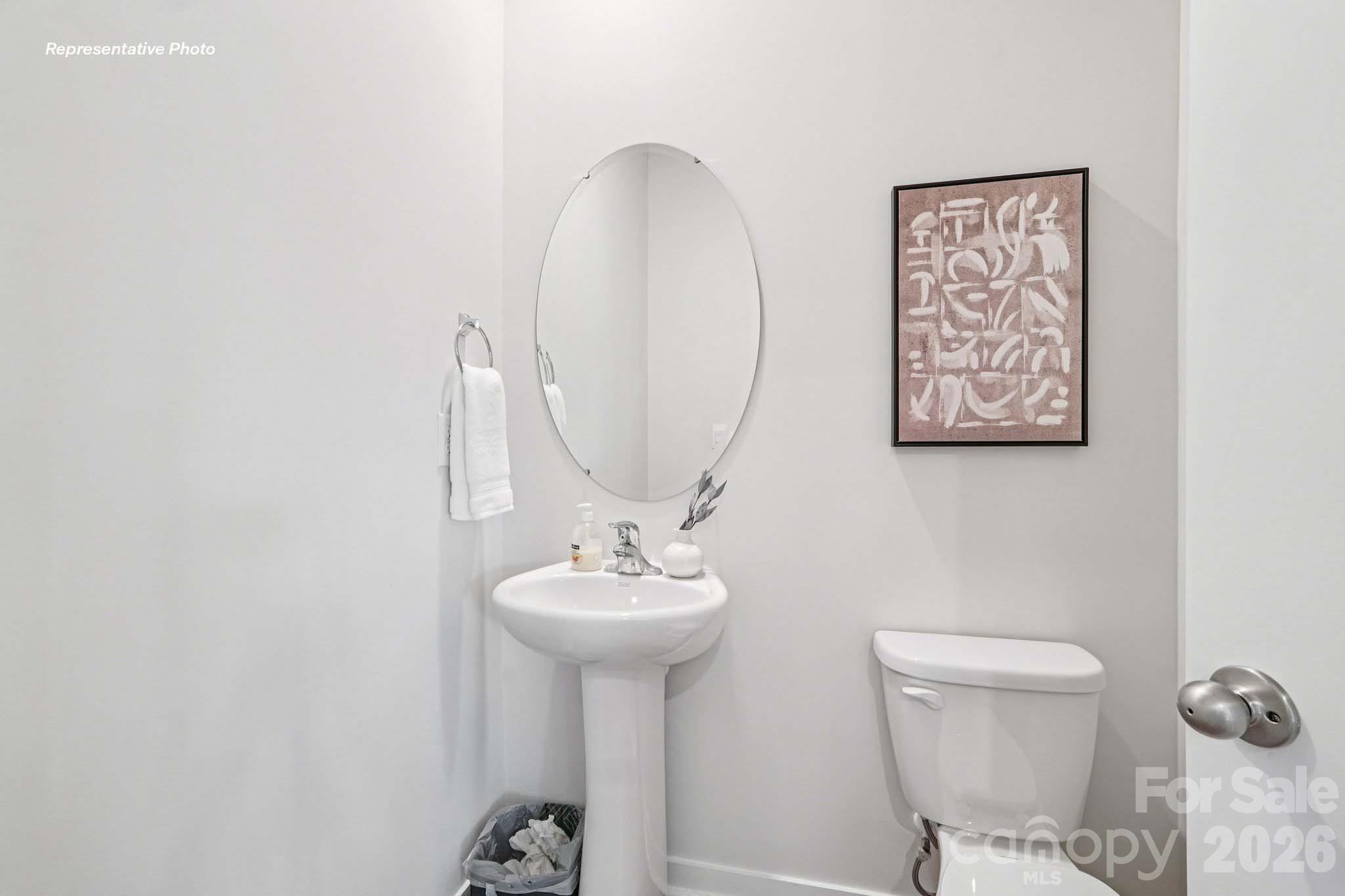 7600 Bainbridge Road Sherrills Ford, NC 28673 - Photo 15 of 39 a bathroom with a toilet sink and mirror