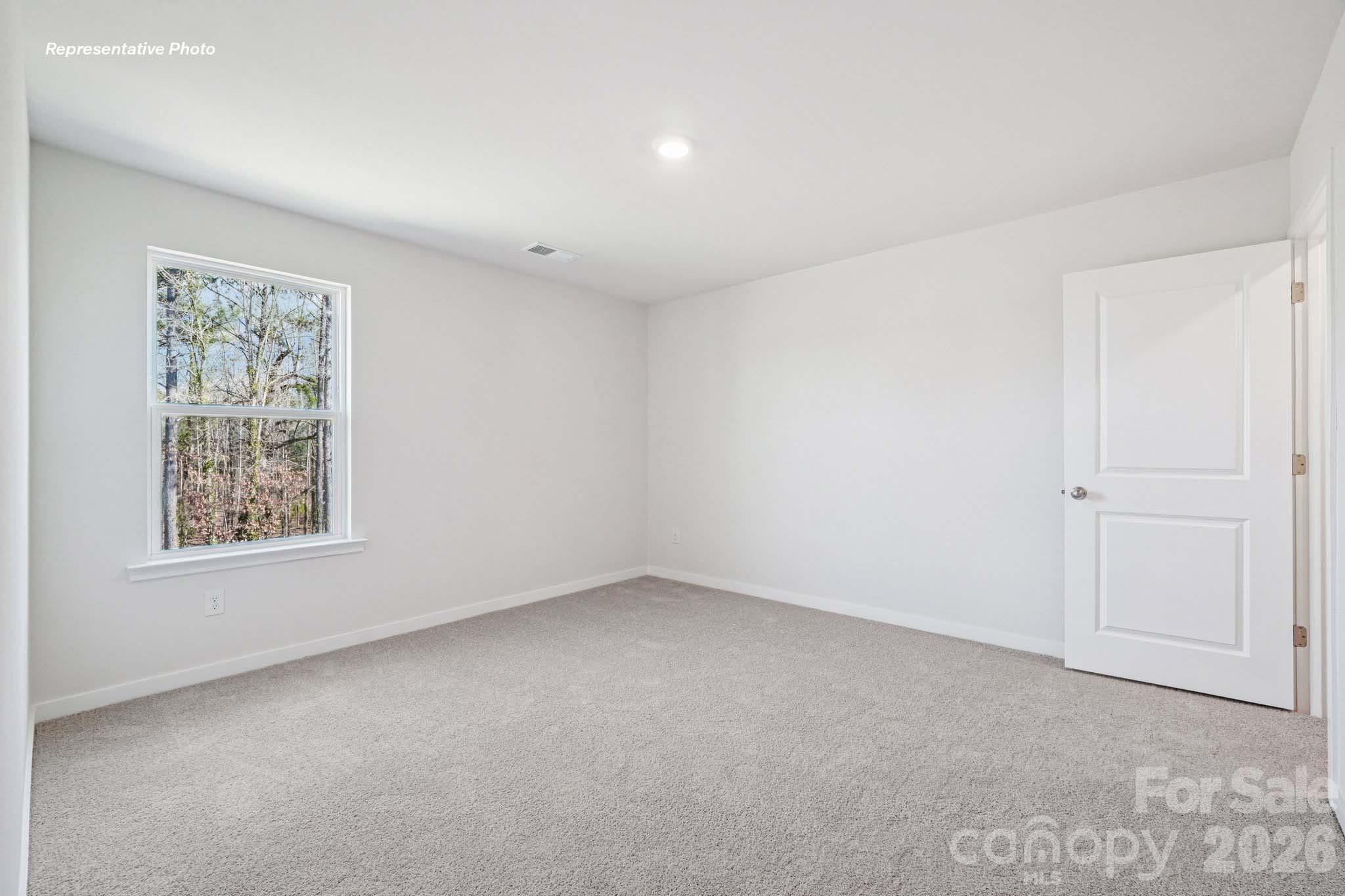 7600 Bainbridge Road Sherrills Ford, NC 28673 - Photo 18 of 39 an empty room with a window