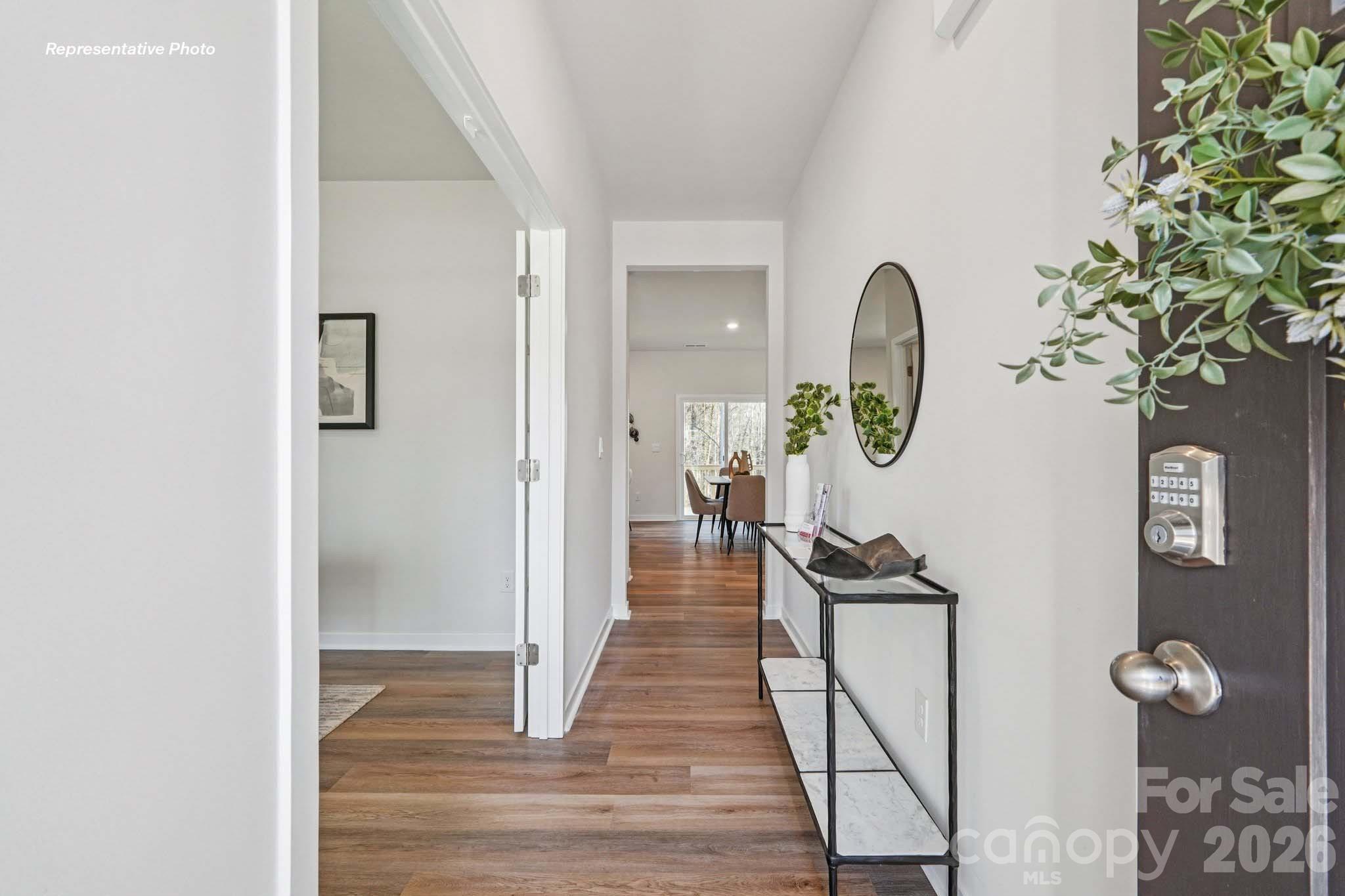 7600 Bainbridge Road Sherrills Ford, NC 28673 - Photo 2 of 39 a view of a hallway with wooden floor and chair