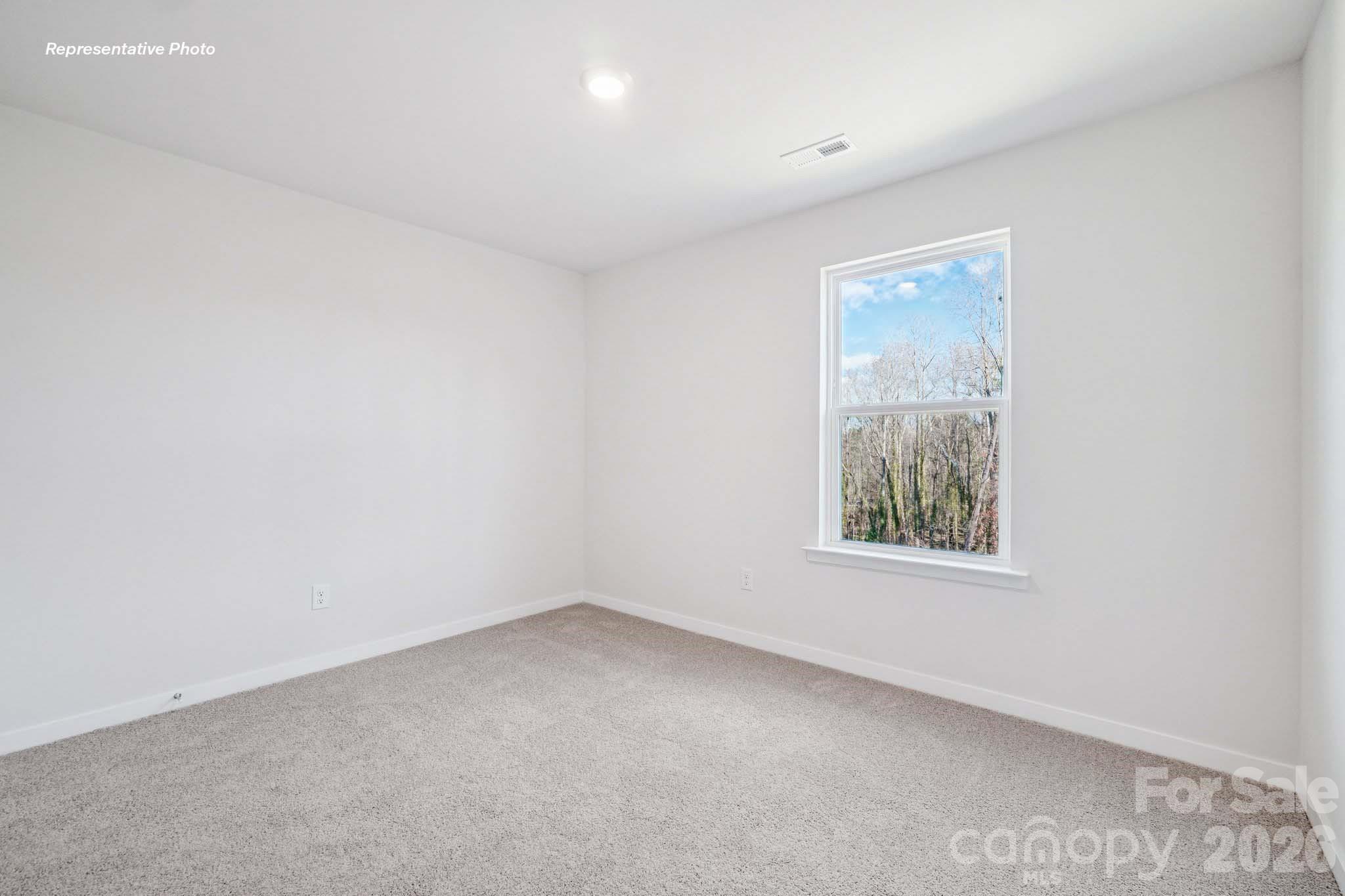 7600 Bainbridge Road Sherrills Ford, NC 28673 - Photo 21 of 39 an empty room with windows