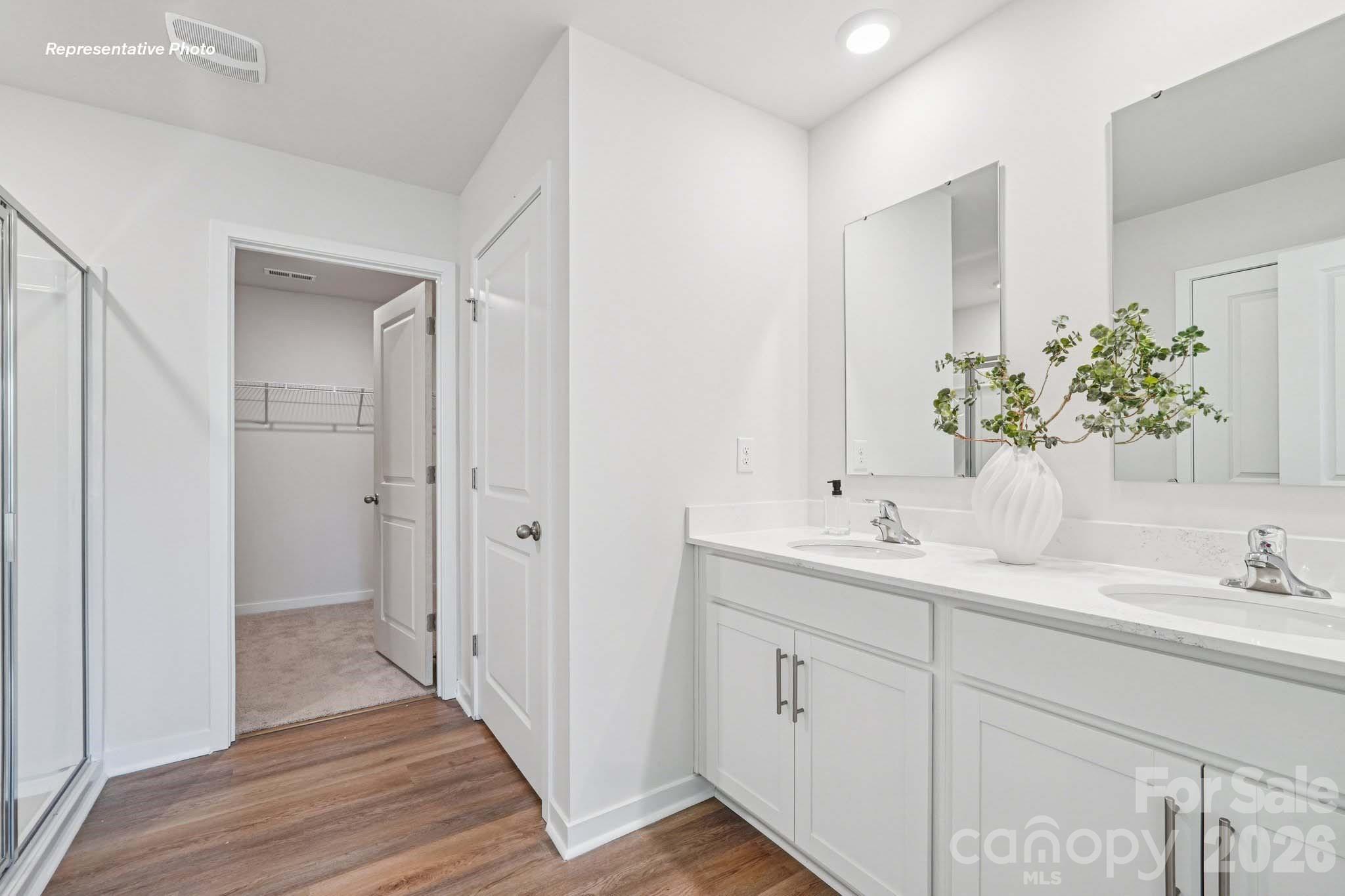 7600 Bainbridge Road Sherrills Ford, NC 28673 - Photo 32 of 39 a bathroom with a double vanity sink and mirror