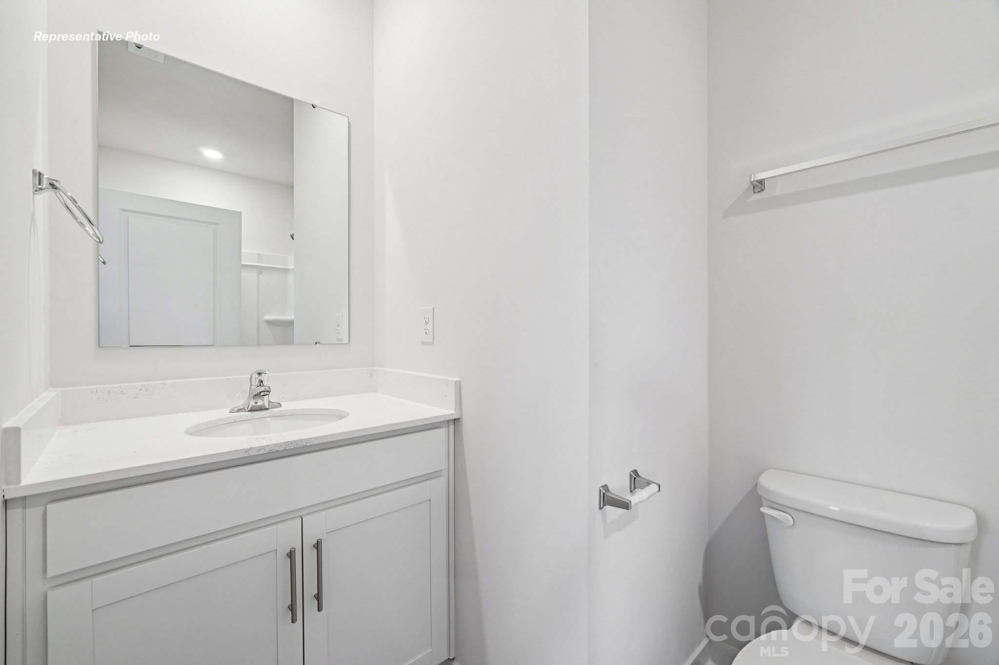 7600 Bainbridge Road Sherrills Ford, NC 28673 - Photo 37 of 39 a bathroom with a sink toilet and vanity