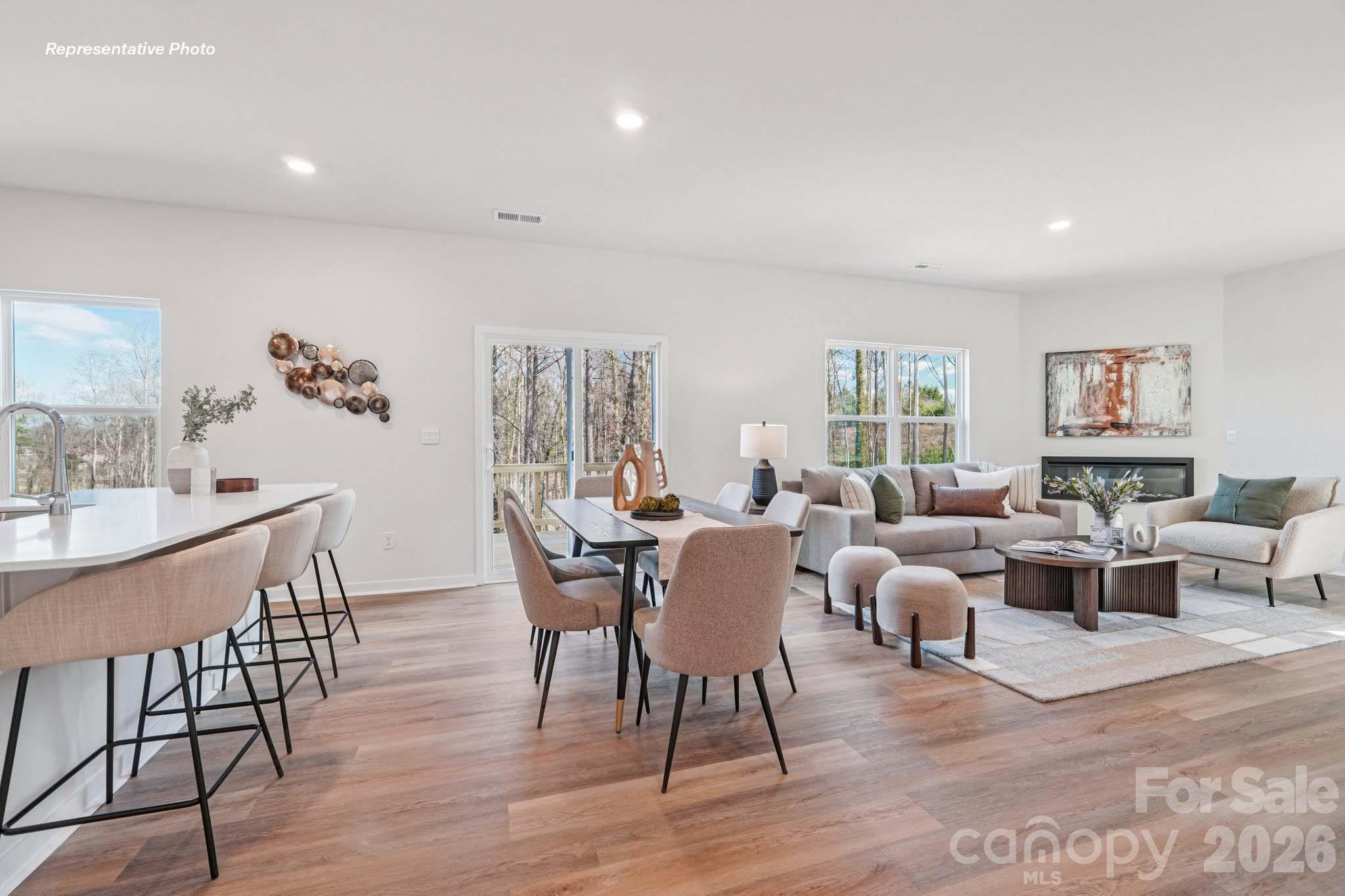 7600 Bainbridge Road Sherrills Ford, NC 28673 - Photo 7 of 39 a view of a dining room with furniture window and wooden floor