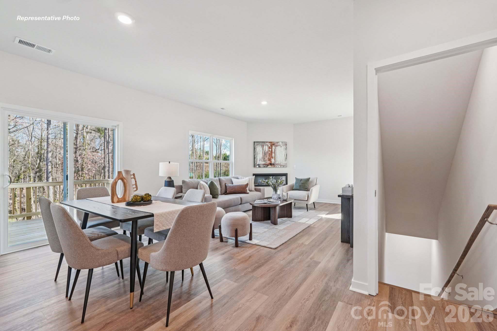 7600 Bainbridge Road Sherrills Ford, NC 28673 - Photo 8 of 39 a view of a dining room with furniture window and wooden floor