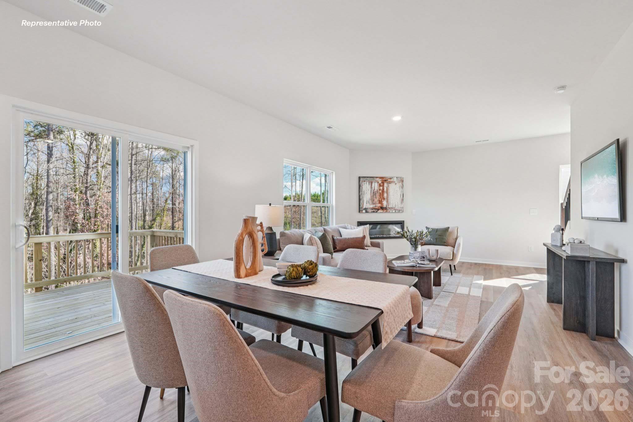 7600 Bainbridge Road Sherrills Ford, NC 28673 - Photo 9 of 39 a view of a dining room with furniture window and wooden floor
