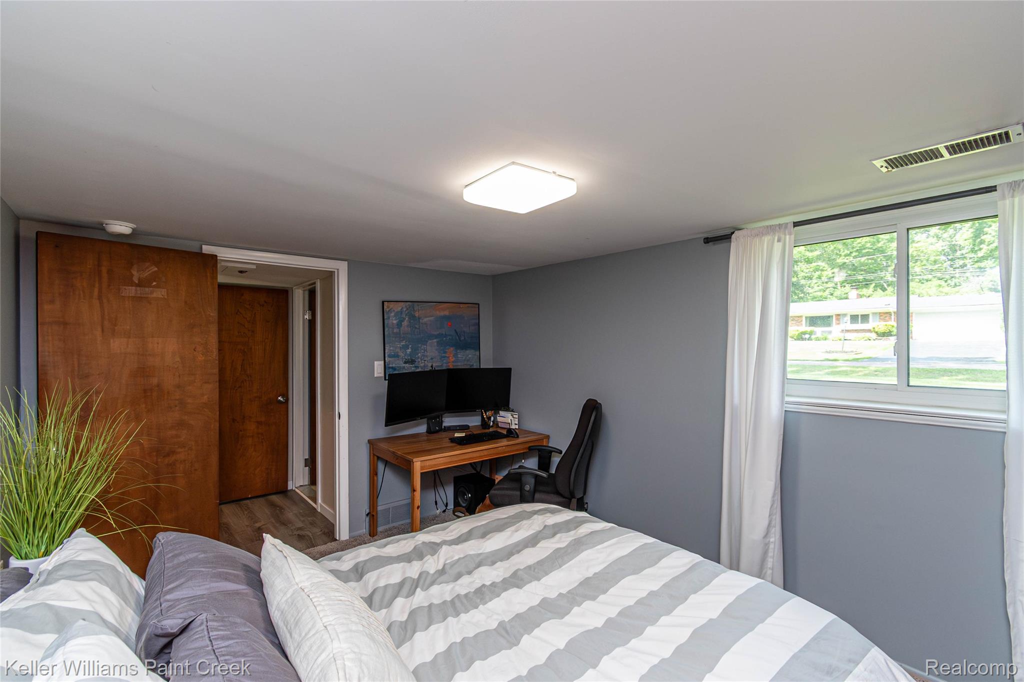 7093 Stonebrook Road West Bloomfield, MI 48322 - Photo 53 of 64 Room featuring a light gray painted wall and wood-finish flooring