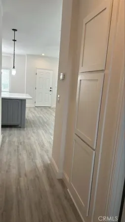 a view of a room with wooden floor