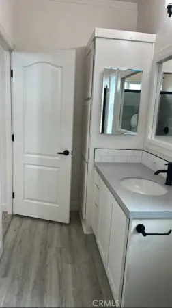 a bathroom with a sink and mirror