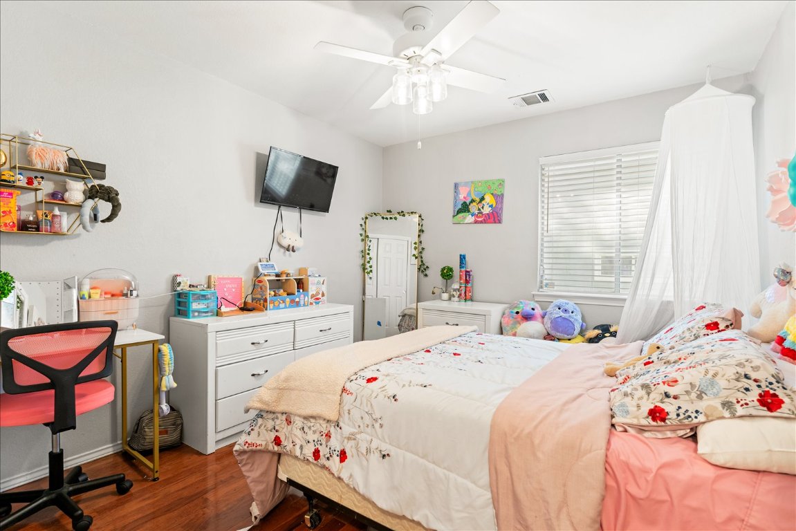 4456 Mather Kyle, TX 78640 - Photo 18 of 25 Bedroom with dark wood-style flooring and a ceiling fan