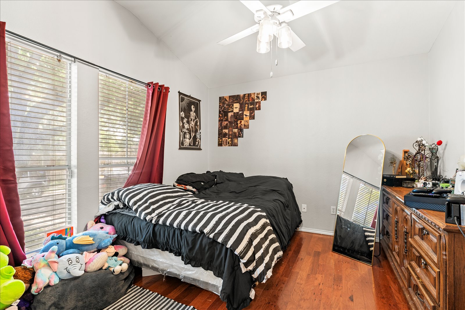 4456 Mather Kyle, TX 78640 - Photo 19 of 25 Bedroom featuring vaulted ceiling, dark wood-style flooring, and a ceiling fan