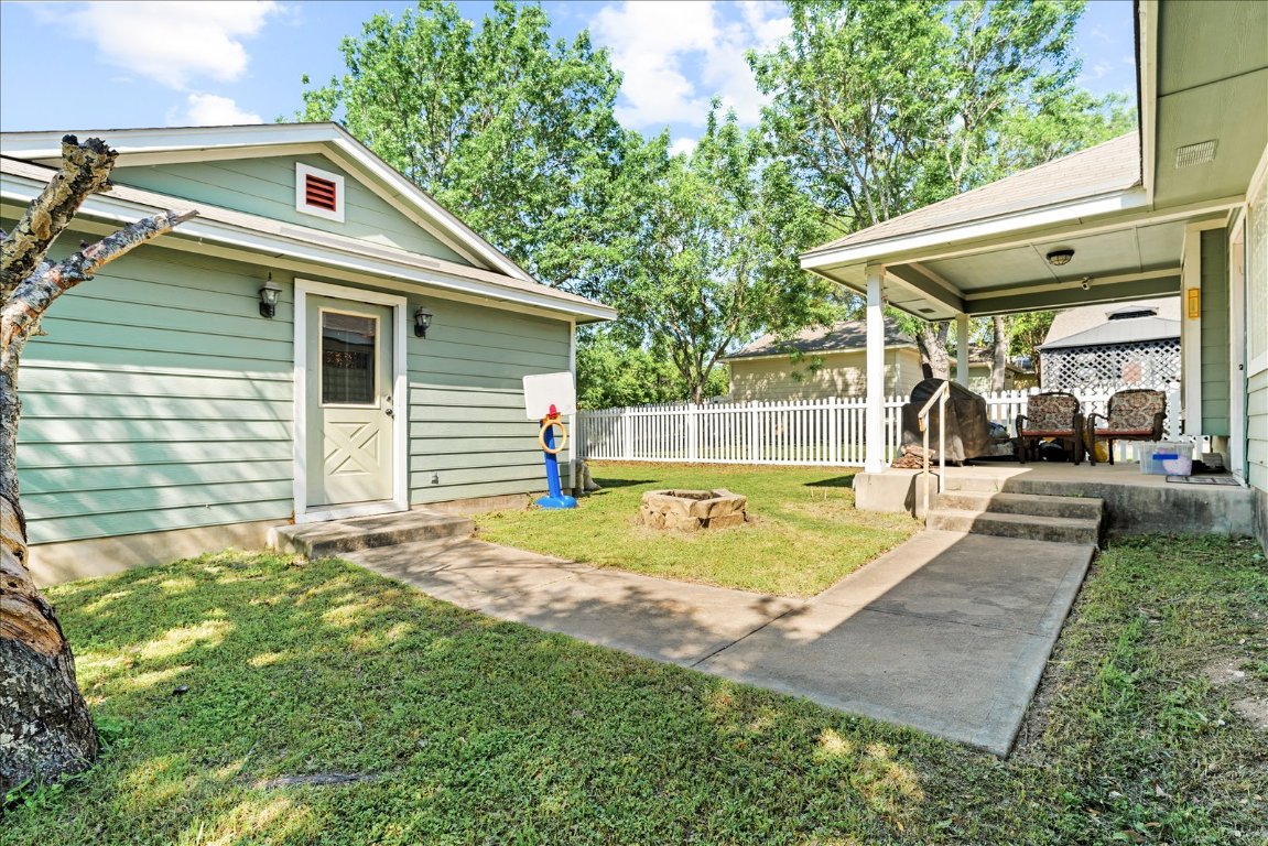 4456 Mather Kyle, TX 78640 - Photo 21 of 25 View of yard with an outdoor fire pit