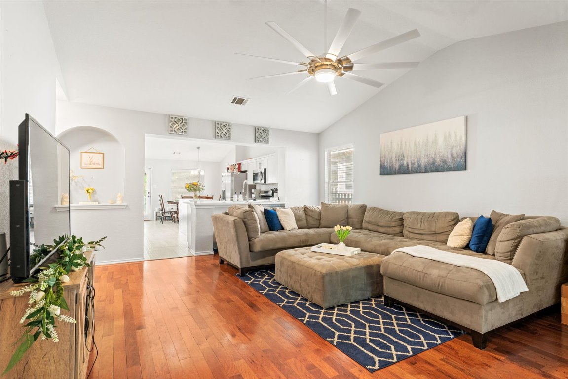 4456 Mather Kyle, TX 78640 - Photo 4 of 25 Living room with vaulted ceiling, ceiling fan, hardwood / wood-style flooring, and plenty of natural light
