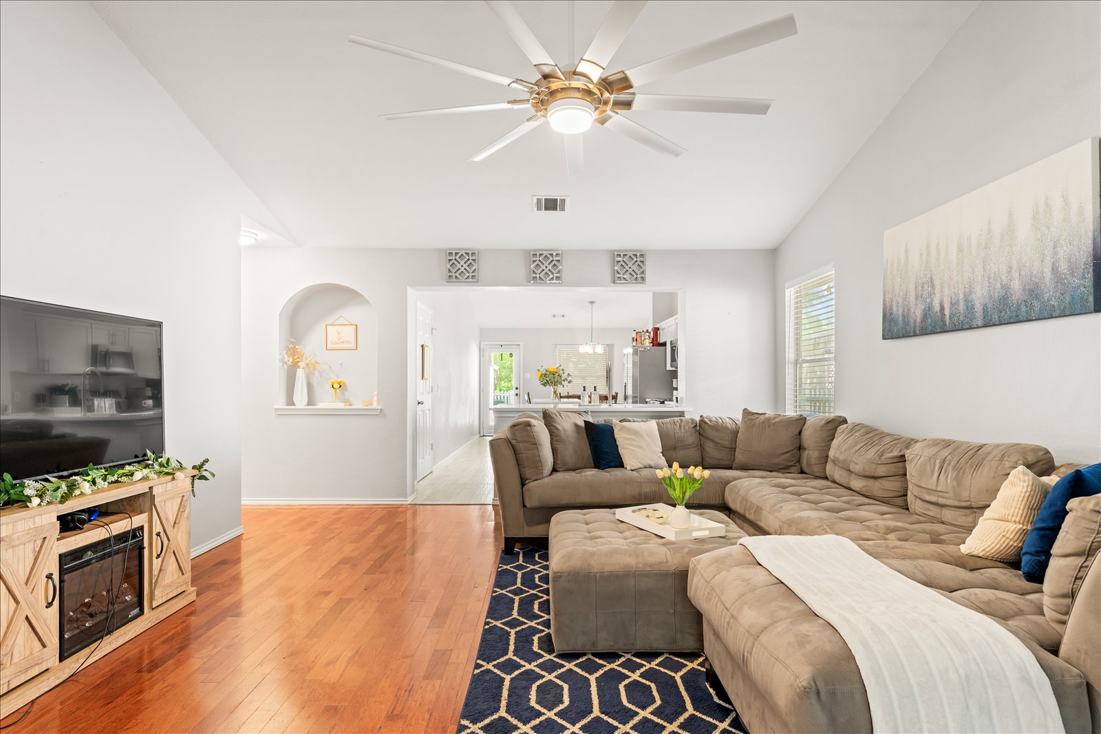 4456 Mather Kyle, TX 78640 - Photo 5 of 25 Living room featuring healthy amount of natural light, hardwood / wood-style floors, and a ceiling fan