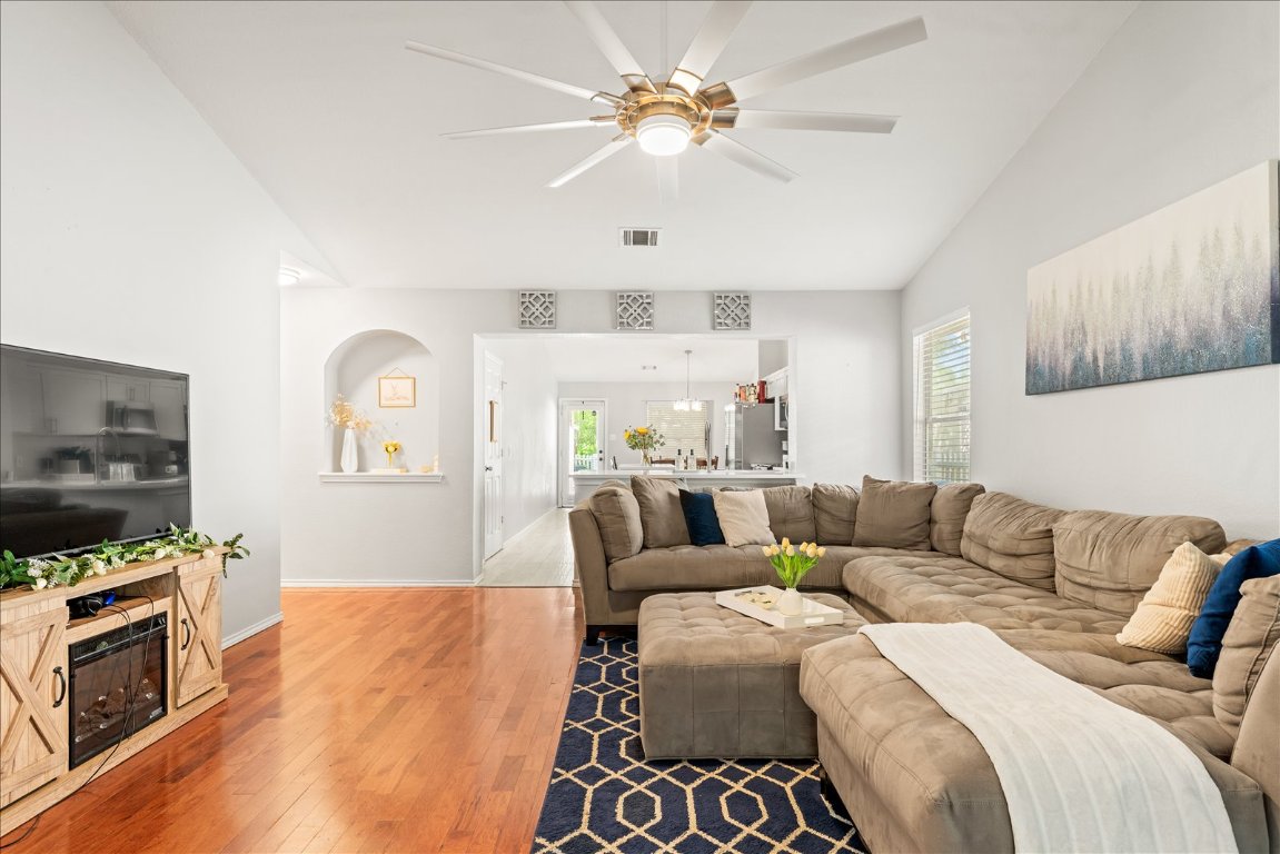 4456 Mather Kyle, TX 78640 - Photo 5 of 25 Living room featuring healthy amount of natural light, hardwood / wood-style floors, and a ceiling fan