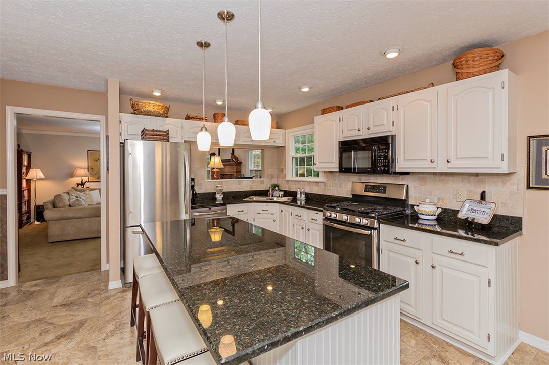 6575 Liberty Road Solon, OH 44139 - Photo 3 of 30 Beautifully updated kitchen with granite counter tops and stainless steel appliances