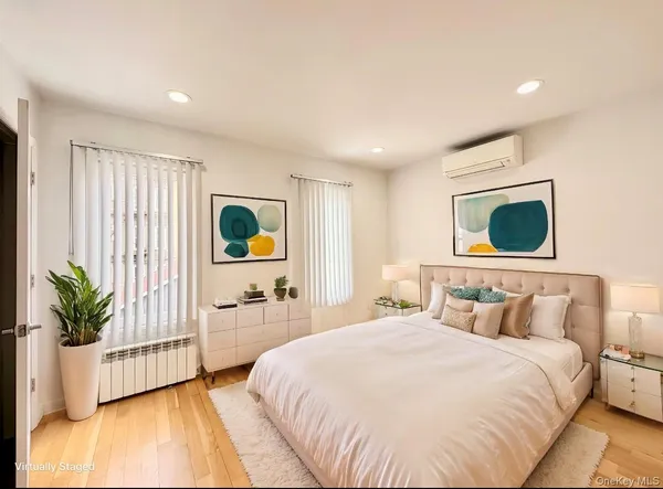 a bedroom with a bed and a couch