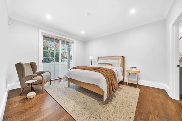 a bedroom with a bed and a couch