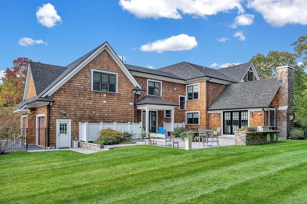 a front view of a house with a garden and porch