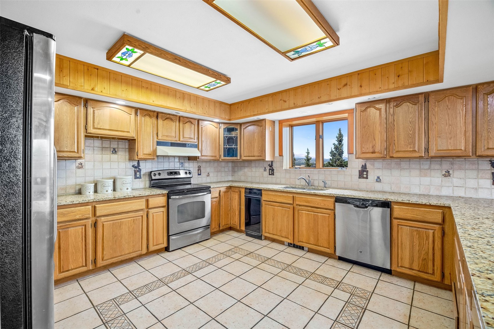 597 Sheep Ridge Road Fairplay, CO 80440 - Photo 8 of 50 a kitchen with stainless steel appliances granite countertop a sink and cabinets