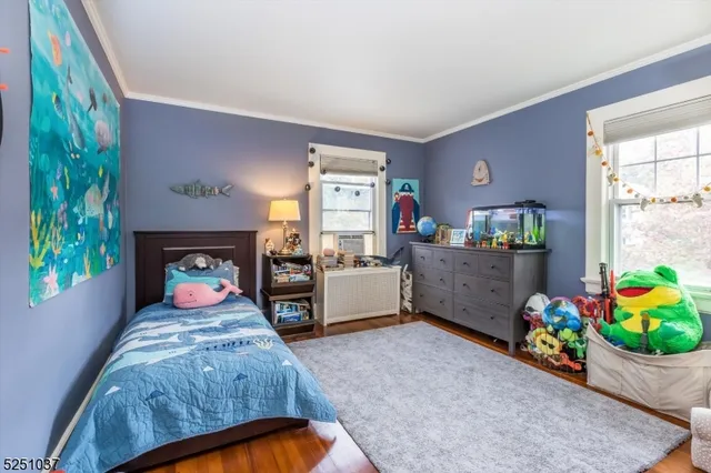 a bedroom with bed and a window