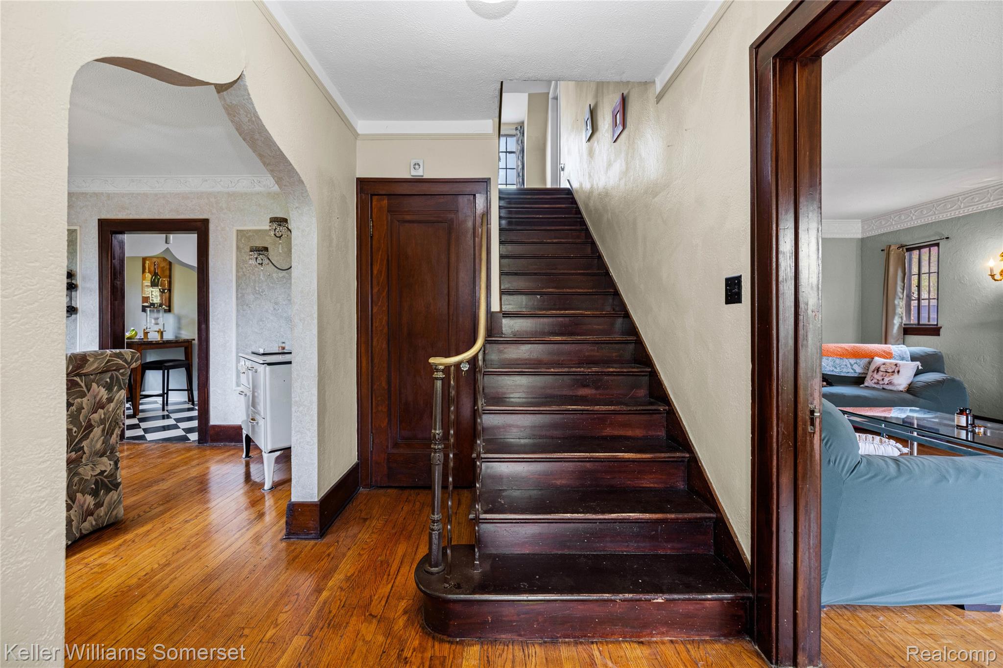 15 Miami Road Pontiac, MI 48341 - Photo 8 of 68 Stairway featuring ornamental molding, hardwood / wood-style flooring, arched walkways, and a textured wall