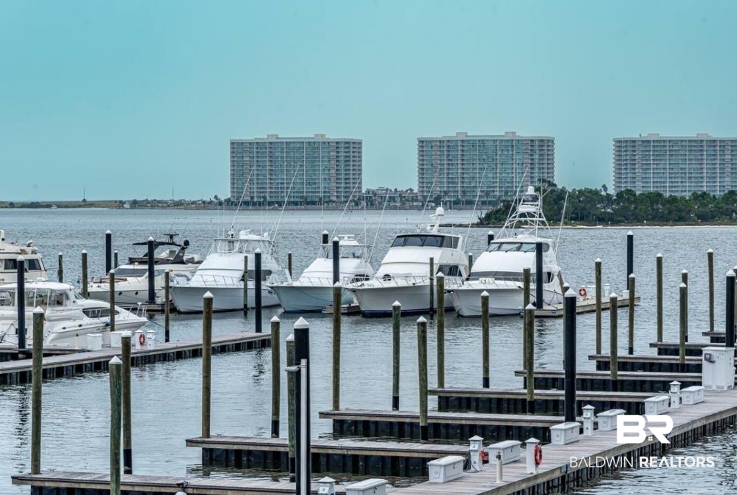 27800 Canal Road, Unit 212 Orange Beach, AL 36561 - Photo 4 of 43 View of dock featuring a water view