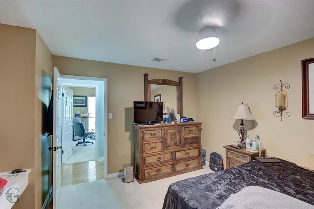 a bedroom with a bed and furniture