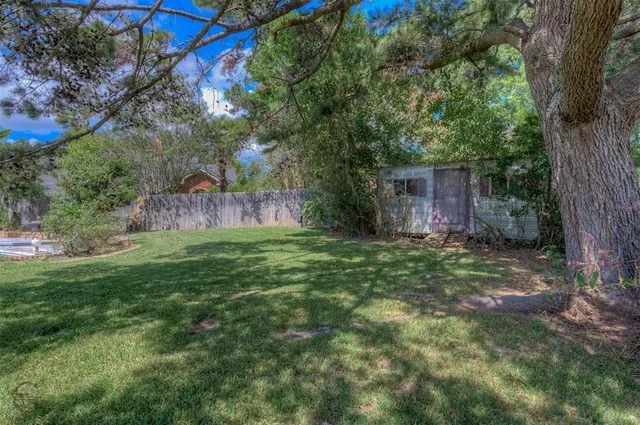 a backyard of a house with lots of green space