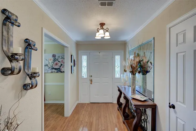 a view of a hallway with a flower pot