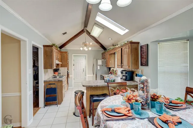 a very nice looking dining room with furniture