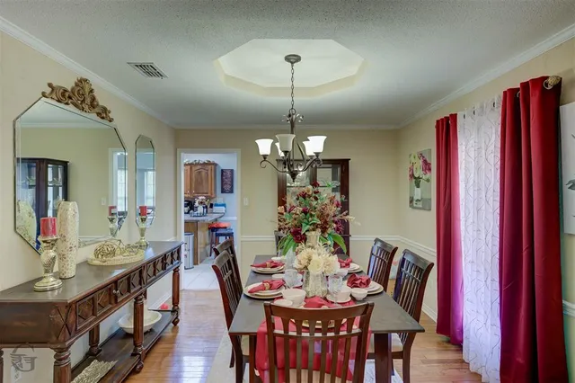 a view of a dining room with furniture and window