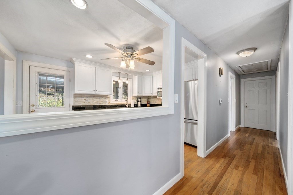 9 Bailey Lane Georgetown, MA 01833 - Photo 15 of 42 a view of a kitchen with a sink a refrigerator and window
