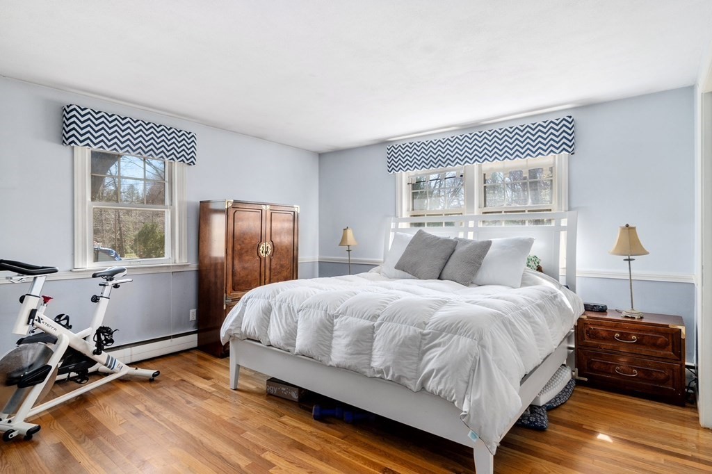 9 Bailey Lane Georgetown, MA 01833 - Photo 16 of 42 a bedroom with a bed and wooden floor