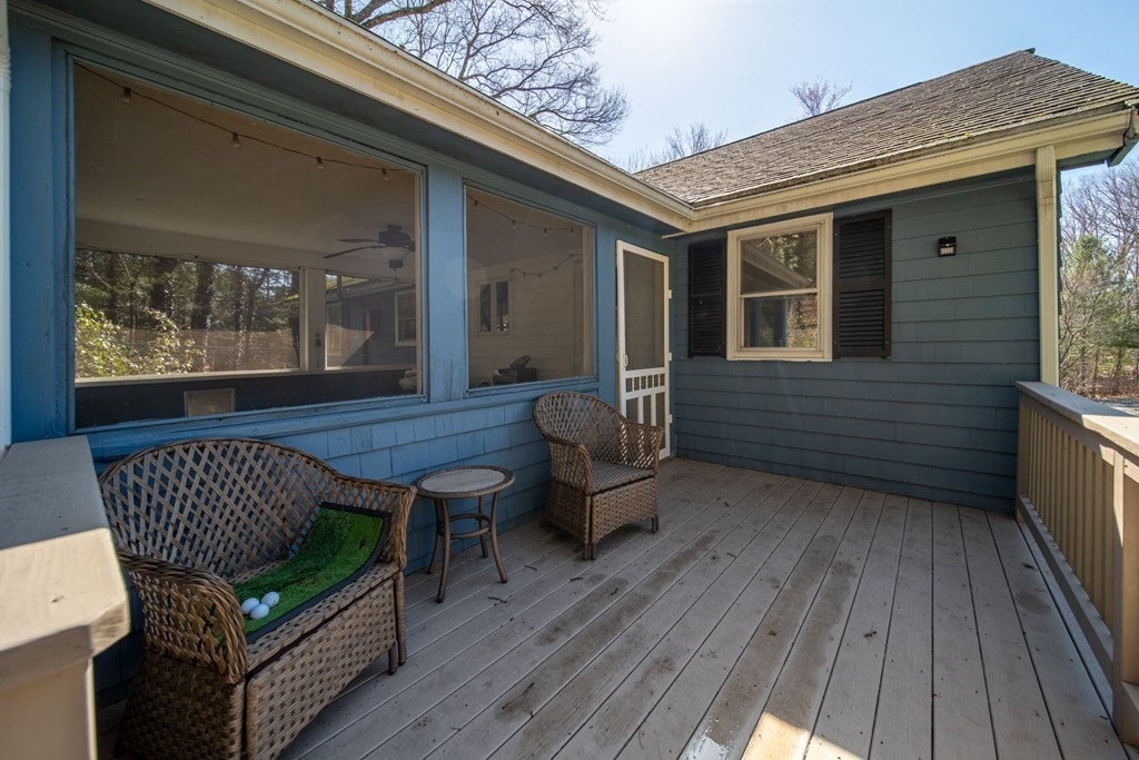 9 Bailey Lane Georgetown, MA 01833 - Photo 17 of 42 a view of a patio with a table and chairs