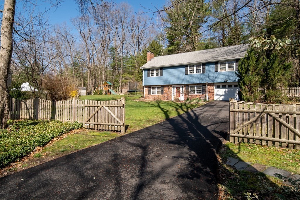 9 Bailey Lane Georgetown, MA 01833 - Photo 2 of 42 a view of a wooden deck with a yard