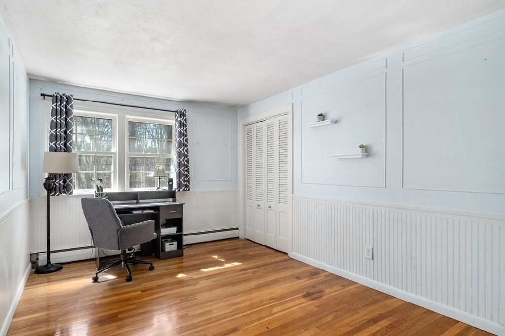 9 Bailey Lane Georgetown, MA 01833 - Photo 22 of 42 a view of a workspace with wooden floor and a window